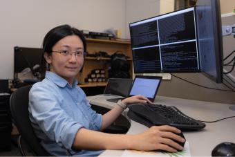 Sihui Li works on a computer
