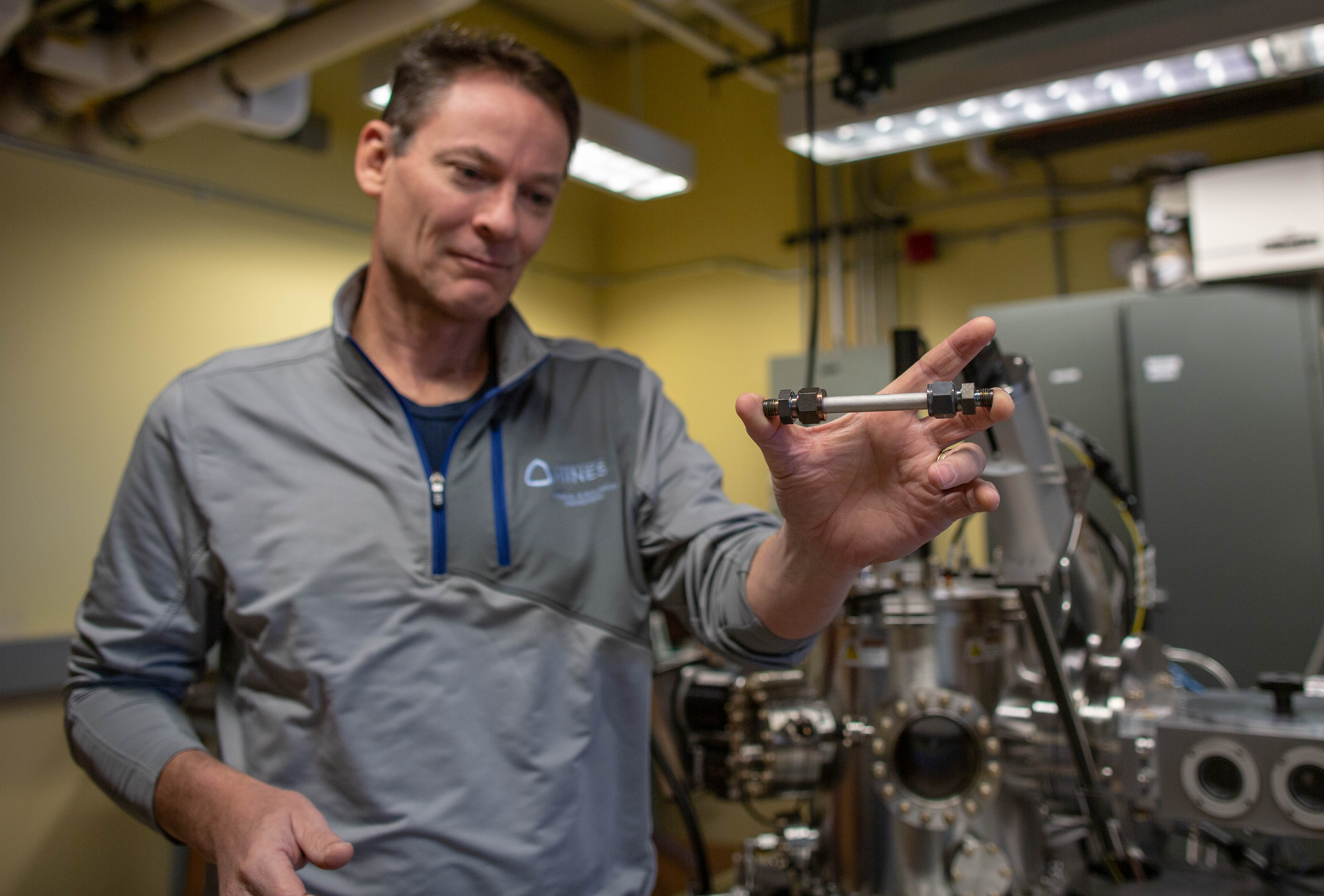 Mines Professor Colin Wolden with a catalytic membrane reactor