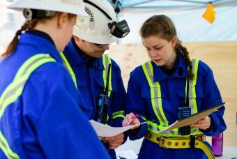 Fresh Air Base and Lead Technician Martina Gilbert, right, talks to Jaume Martinez Calvo and Sarah Vanhook about the competition problem.