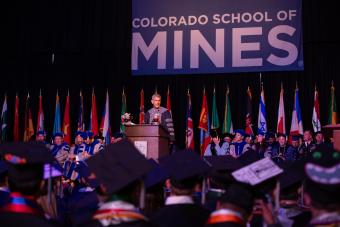 PCJ on stage during Spring 2019 commencement 