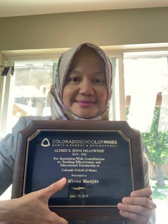 Mirna Mattjik with award plaque