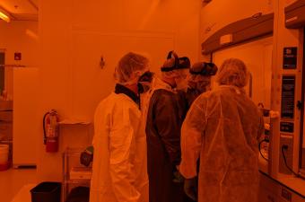 Mines students and faculty working in a clean room