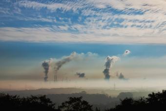 Smoke stacks against blue sky