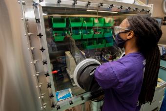 Darius Hayes works in the glovebox in the lab