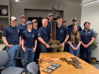 Mines students with Mining Competition trophy
