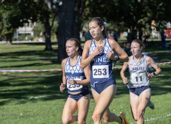 Zoe Baker running at cross country meet