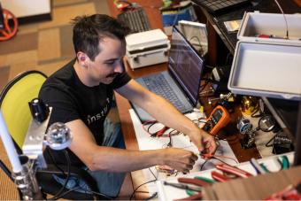 Trevor Bachand works on his sensor tech