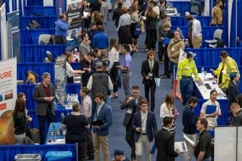 Overhead shot of wide aisle of recruiters and students