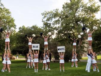 Mines cheer team in formation