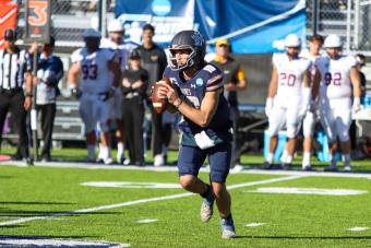 Mines QB John Matocha runs with the football