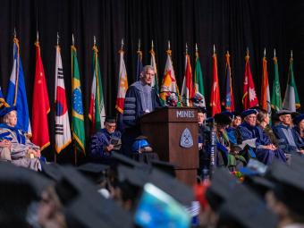 President Johnson speaks during Midyear commencement