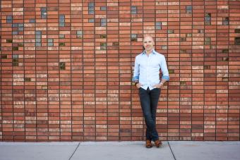 Portrait of Zack Bennett in front of brick wall