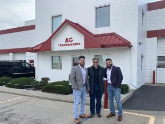 Chris Saykally ’11 and Derek Saykally ’14 outside AC Transmission Total Car Care