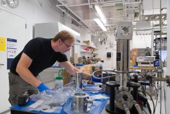 male student works in quantum lab