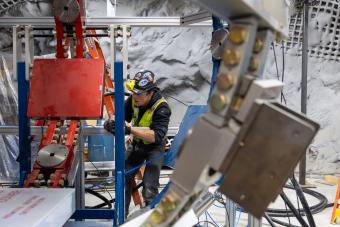 Finnegan Wilson works on a three-ring flash X-ray system inside Edgar Mine