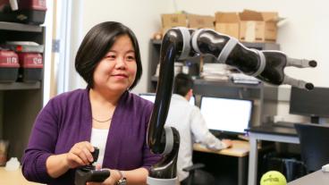 Xiaoli Zhang works in her robotics lab at Mines