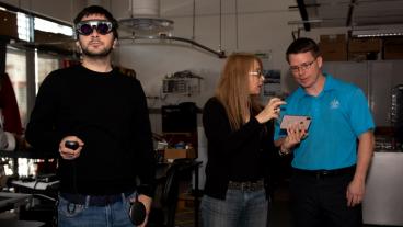 PhD student Doga Cagdas Demirkan tests out AR glasses as Professors Sebnem Duzgun and Andrew Petruska watch the feed.