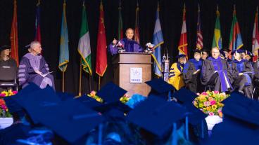 Ed Perlmutter speaks on stage at Mines Commencement