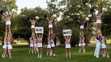 Mines cheer team in formation