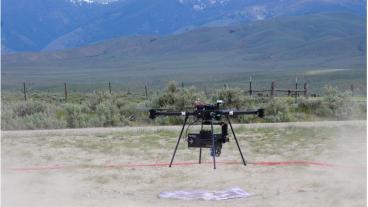 Photo of a drone landing near mountains