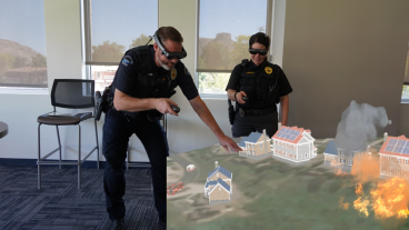 Two police officers conduct a virtual tabletop exercise