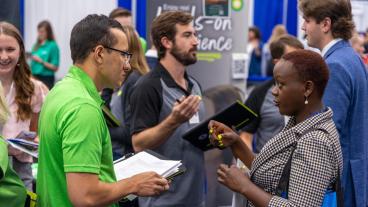Geophysical engineering PhD student Dorothy Kanini Mwanzia meets with Adam Tuppen '19 from BP Energy.