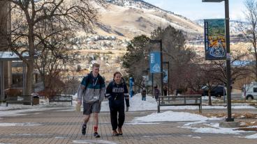 students walking on pedestrian plaza in january