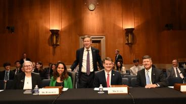 Sen. Hickenlooper with Bill Zisch and other witnesses at Senate committee hearing