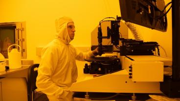 Male student works in quantum clean room