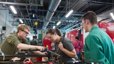three students work in makerspace inside the Labriola Innovation Hubat Colorado School of Mines