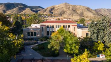 arthur lakes library building in front of foothills in fall