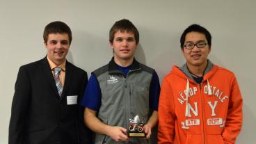 Computer science students Espen Roth, Daniel Mawhirter and Han Tran with their second-place trophy.