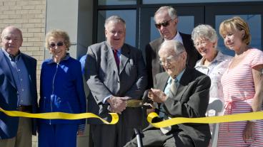 Dr. W. Lloyd Wright cuts the ribbon at a grand opening for the new wellness center that bears his name.