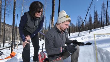 Associate Professor Terri Hogue works with graduate student Kyle Knipper analyzing snow properties and water content in the burned areas of the Rio Grande headwaters.