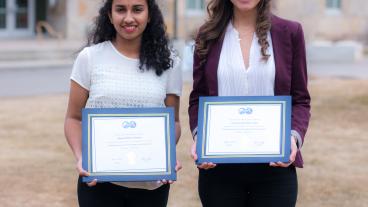 Manju and Jessica with their award plaques.
