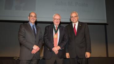 John Poate, center, inducted as NAI Fellow.