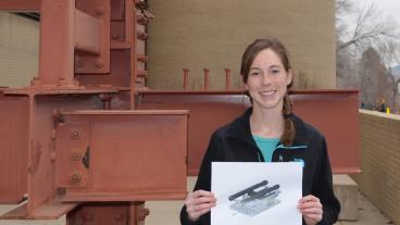 Kat Bujnoch, with a sketch of the design of an underwater vehicle that can move around and transport objects.