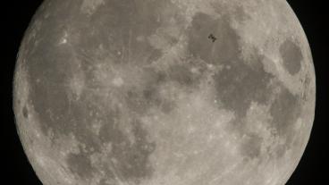 NASA photo of International Space Station passing in front of the moon
