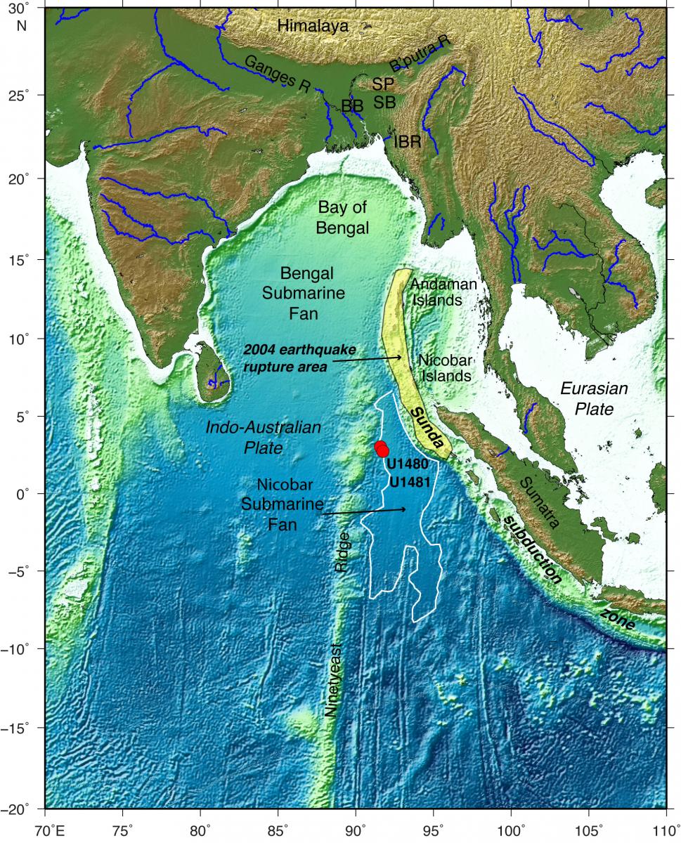 Map of the eastern Indian Ocean and surrounding regions. Location of the drilling expedition and the Sunda subduction zone also shown. The Indo-Australian plate subducts beneath the Eurasian plate at the subduction zone and it was the source of the 2004 earthquake and tsunami offshore Sumatra to Andaman Islands (rupture area shaded in yellow). Ocean drilling boreholes are red dots (U1480, U1481). The Bengal and Nicobar submarine fans are fed by river sediments eroded from the Himalaya and Tibetan Plateau, creating very large thicknesses of sediment. (Credit: Lisa McNeill, University of Southampton.)