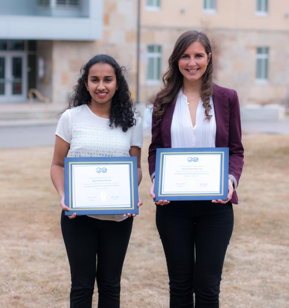 Manju and Jessica with their award plaques.