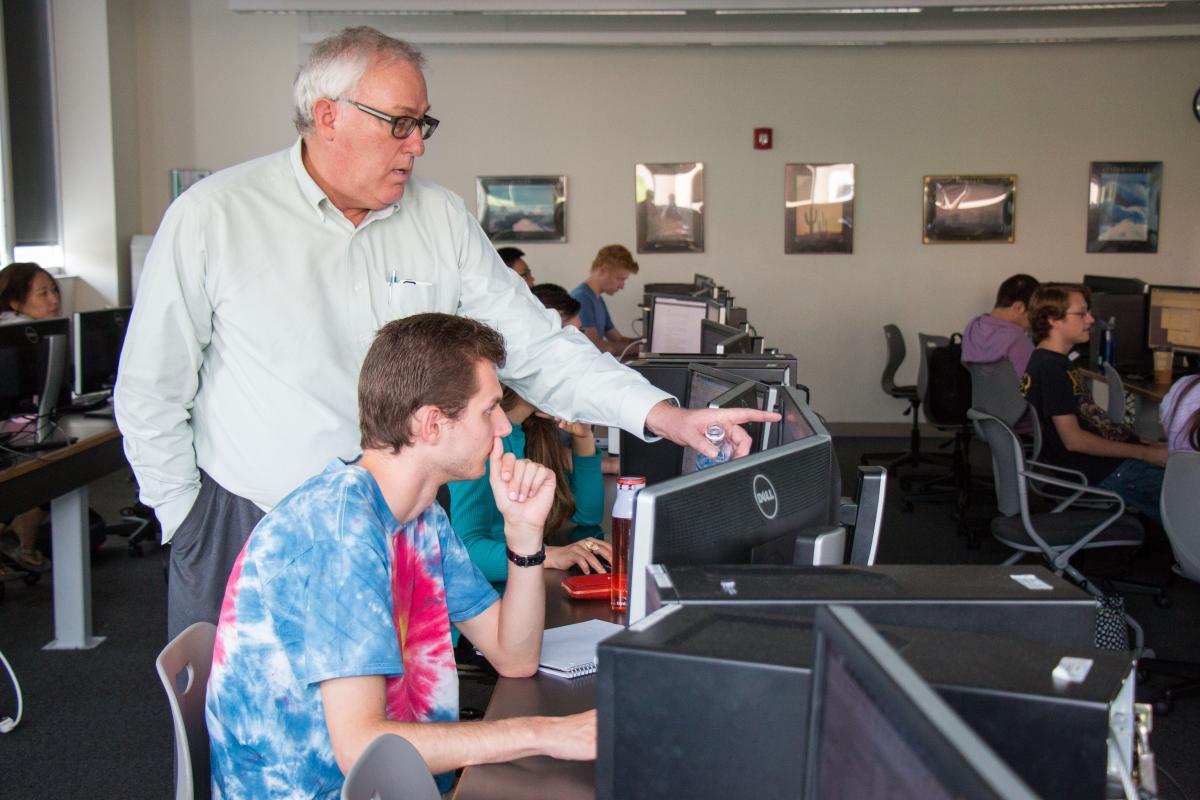 Tom Bratton teaches students how to use well-modeling software used in the industry.